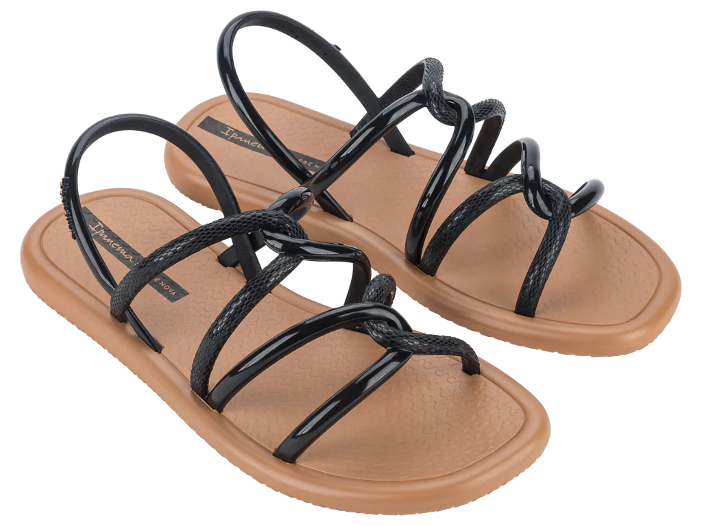 Pair of sandals with black straps on a white background
